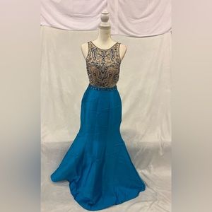 Say yes to the prom dress; Blue sleeveless mermaid gown with blue beading.